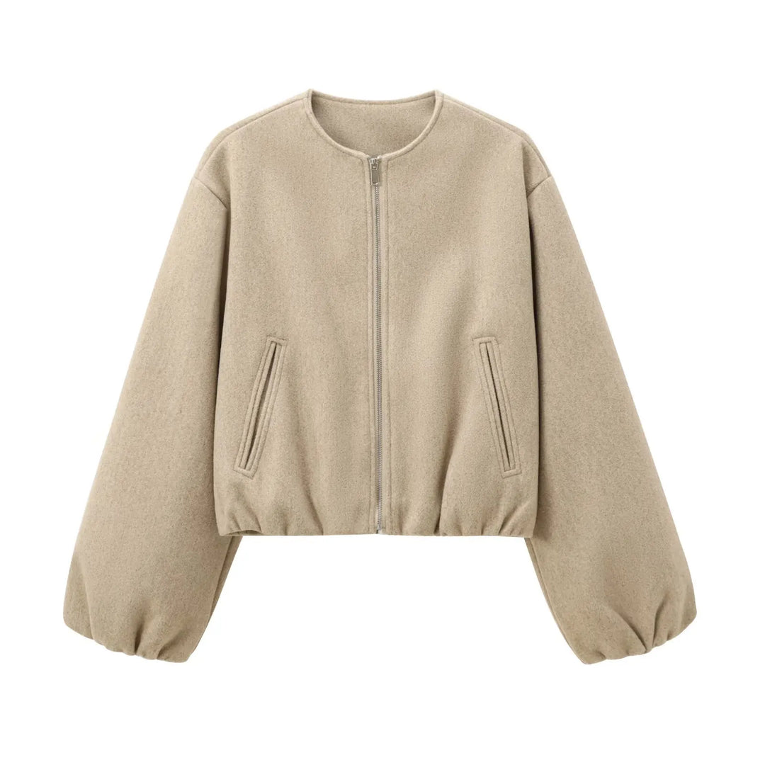 Woman wearing a stylish cropped lightweight bomber jacket with balloon sleeves, great for autumn fashion.