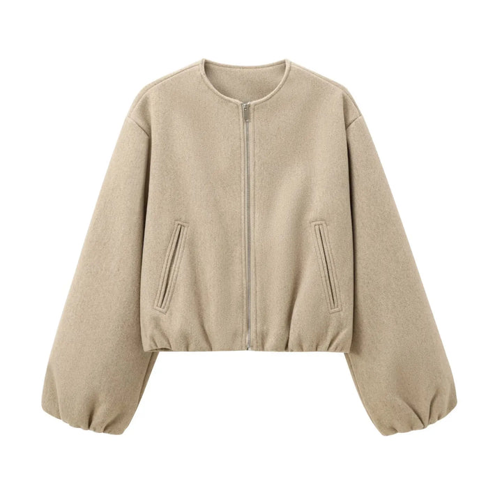 Woman wearing a stylish cropped lightweight bomber jacket with balloon sleeves, great for autumn fashion.