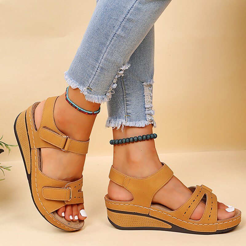 Pair of women's adjustable strap sandals, offering custom comfort and orthopedic relief