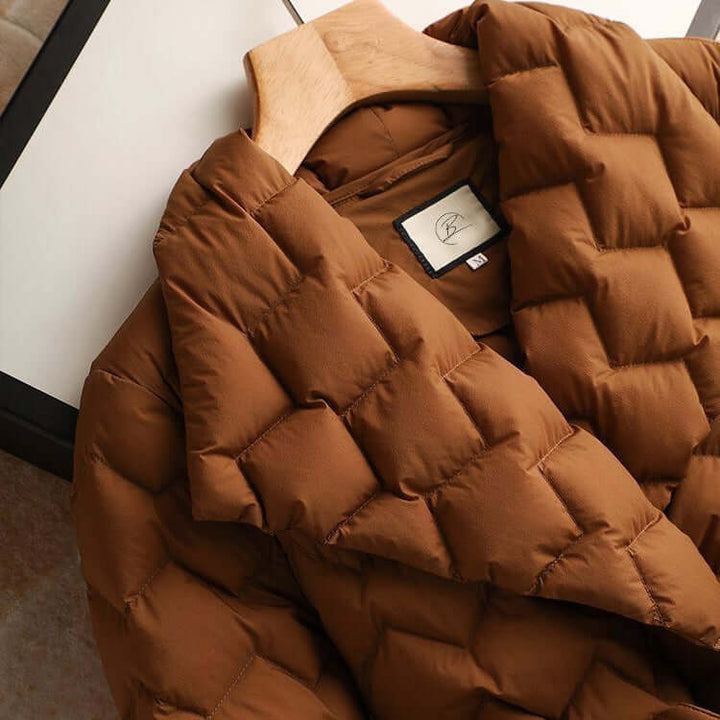 Lightweight women's puffer jacket. Fashionable and warm outerwear for cold weather, perfect for layering.