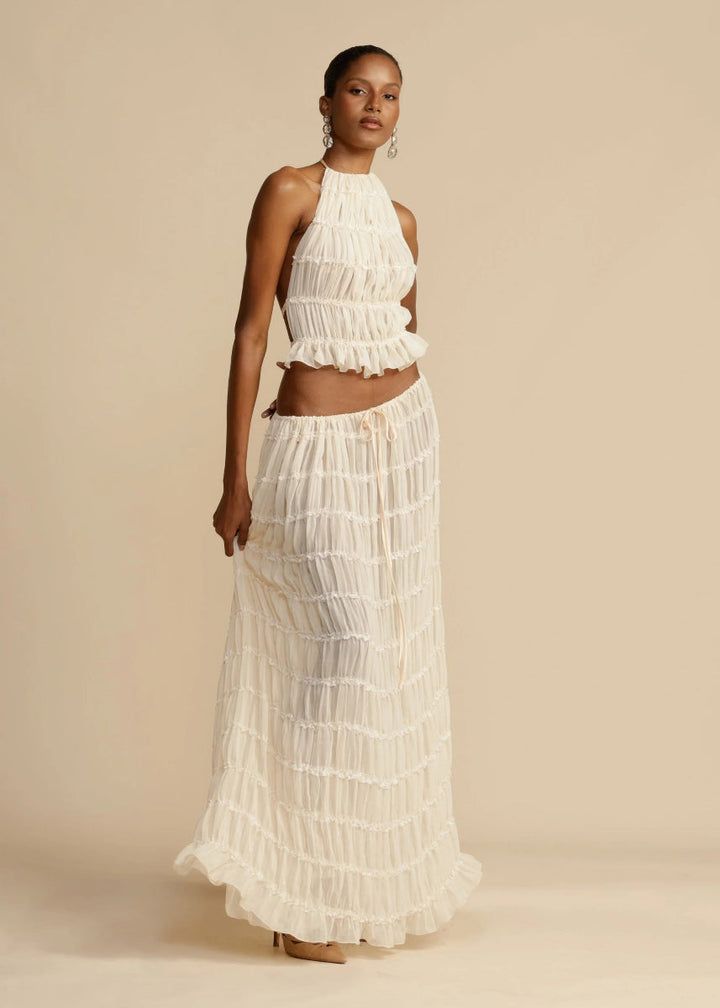 Fashionable women's summer set: a lightweight, breathable halter top and matching flowy maxi skirt.