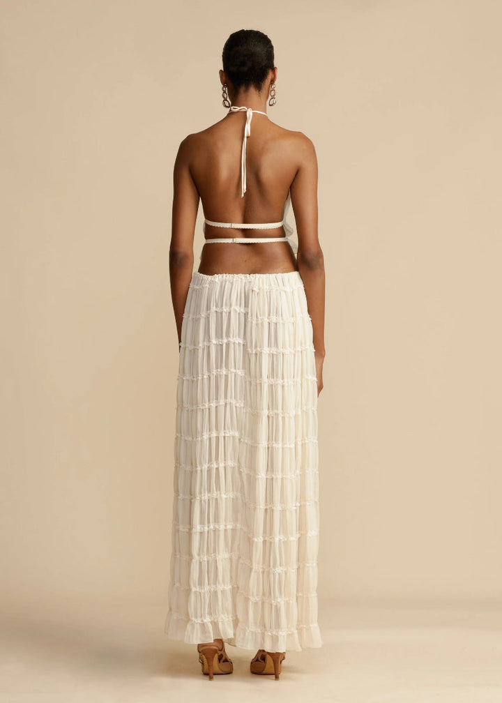 Vacation-ready women's two-piece outfit with a breezy halter top and comfortable, flowy maxi skirt.