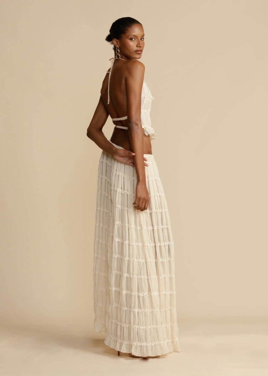 Women's lightweight two-piece outfit. A chic halter top and a long, flowy maxi skirt for summer.