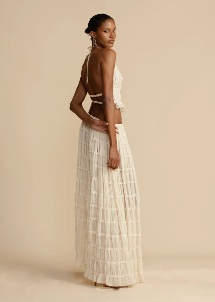 Women's lightweight two-piece outfit. A chic halter top and a long, flowy maxi skirt for summer.