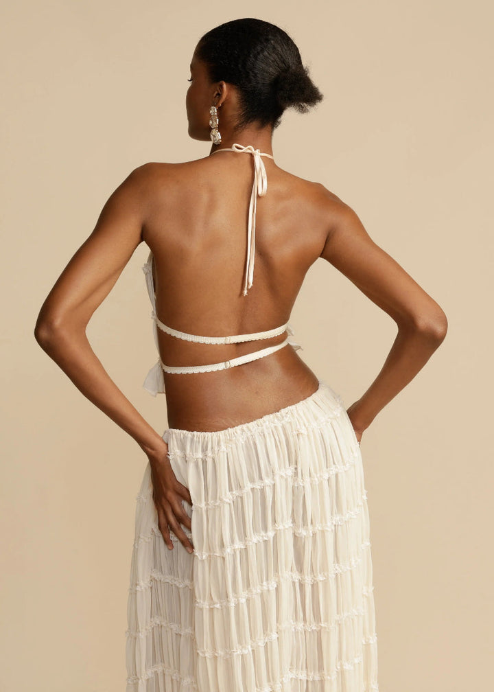 Stylish women's summer two-piece set: a breathable halter top & flowy maxi skirt, ideal for beach.
