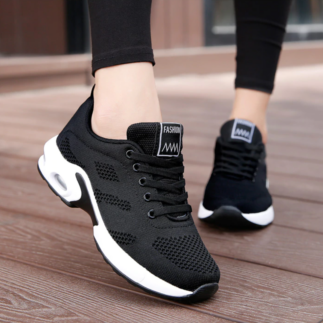 Side view of women's comfortable walking shoes with visible air cushion in the sole.