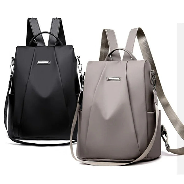 Minimalist lightweight water-resistant nylon backpack for women. Versatile multi-way design for daily use.