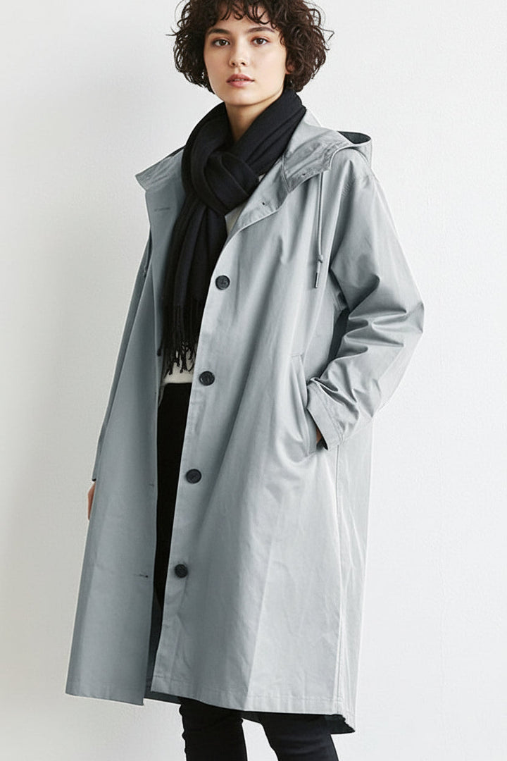 Women's lightweight waterproof hooded rain trench coat for spring & autumn wet weather.