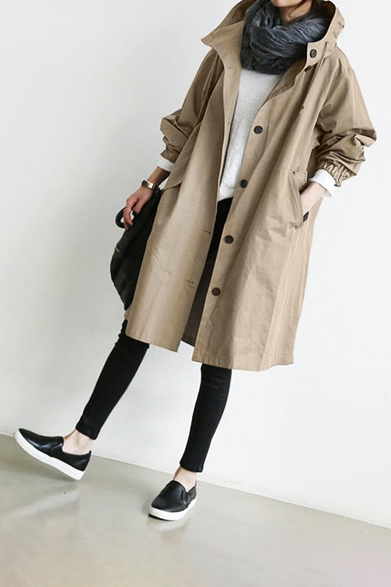Breathable women's lightweight rain trench coat with hood, offers waterproof protection & comfort.