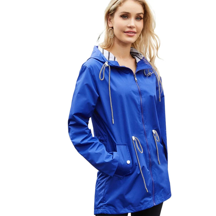 Women's lightweight waterproof hooded trench coat for superior rain protection and style.