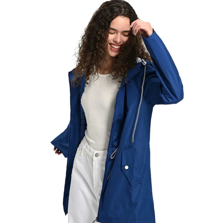 Front view of a women's lightweight waterproof trench coat with hood, essential rain protection jacket.