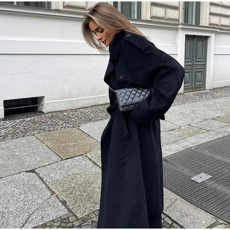 Stylish women's maxi trench coat with belt, classic design for elegant fall/spring fashion.