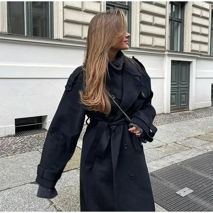 Fashionable women's oversized long trench coat with belt, versatile outerwear for spring/fall.