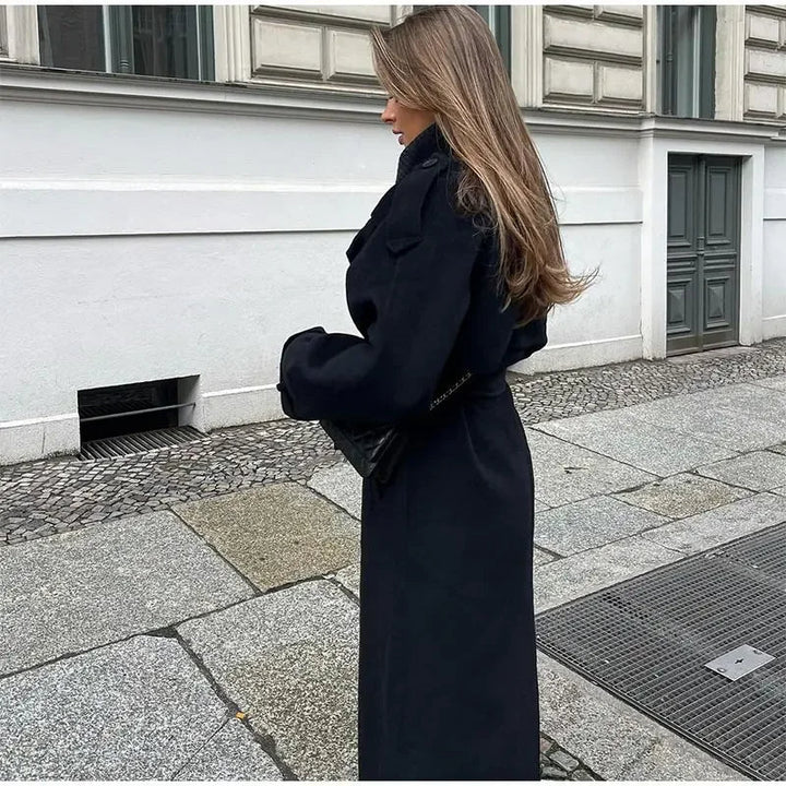 Maxi-length women's trench coat, oversized fit with a belted waist, ideal for spring/fall fashion.