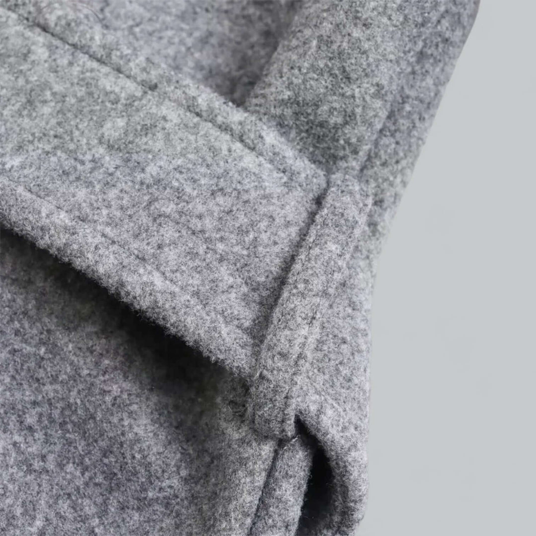 Fashion-forward women's hooded long trench coat, ideal for sophisticated belted autumn style.