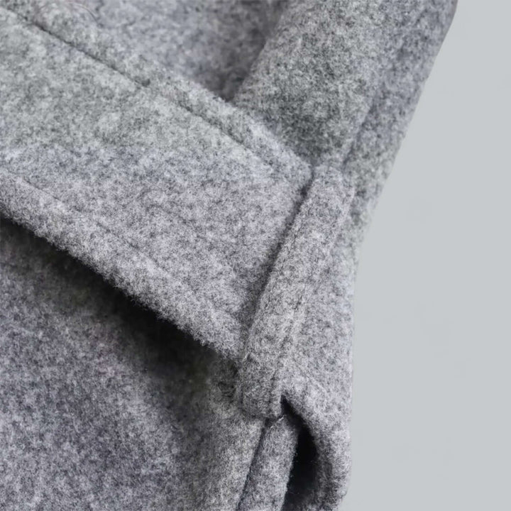 Fashion-forward women's hooded long trench coat, ideal for sophisticated belted autumn style.