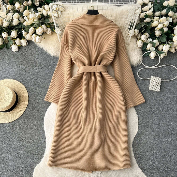 Stylish women's belted long knit cardigan, showcasing a comfortable fit and chic silhouette.
