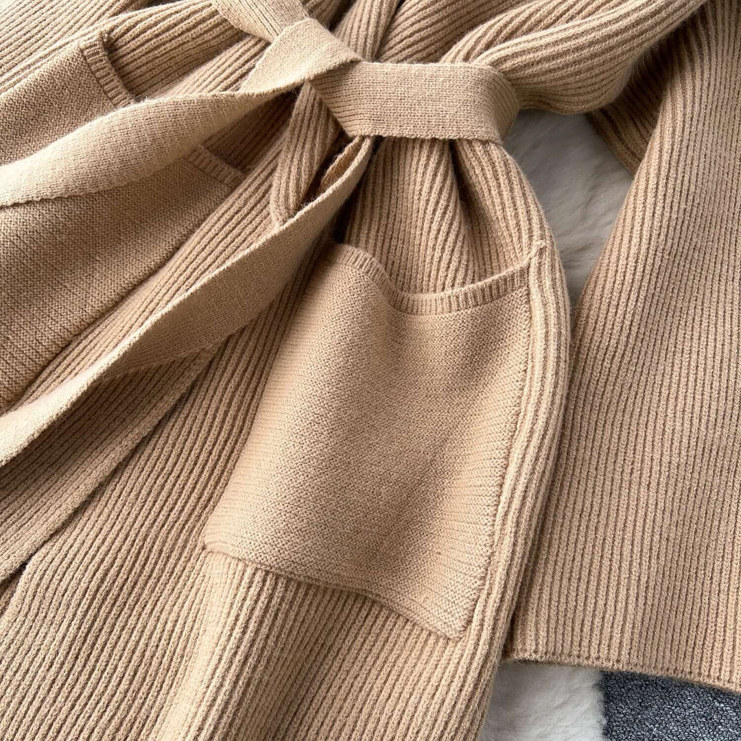 Close-up of a women's long knit cardigan, highlighting the soft fabric and quality knit details.