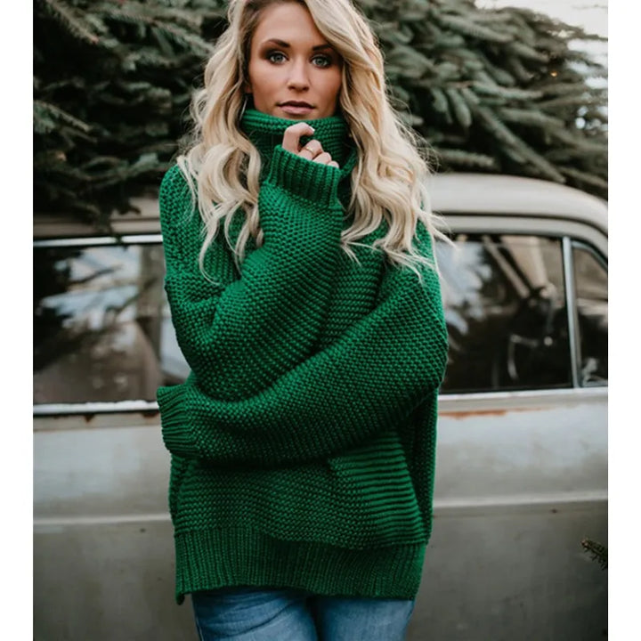 Women's long knit turtleneck sweater. Relaxed, oversized fit for cozy winter fashion. Stylish & versatile.