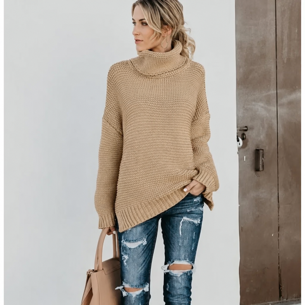 Grey women's long knit turtleneck sweater with a relaxed, oversized design. Cozy winter essential.