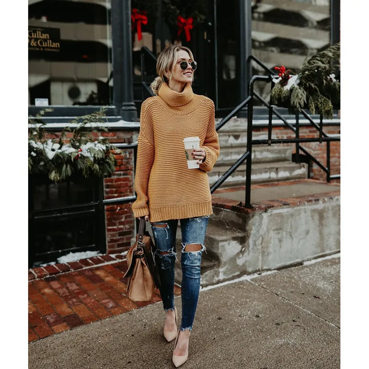 Stylish women's long knit turtleneck sweater. Chic, relaxed fit perfect for versatile winter outfits.