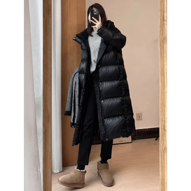 Warm & stylish women's long padded jacket. Essential winter coat and fashionable cold weather outerwear.