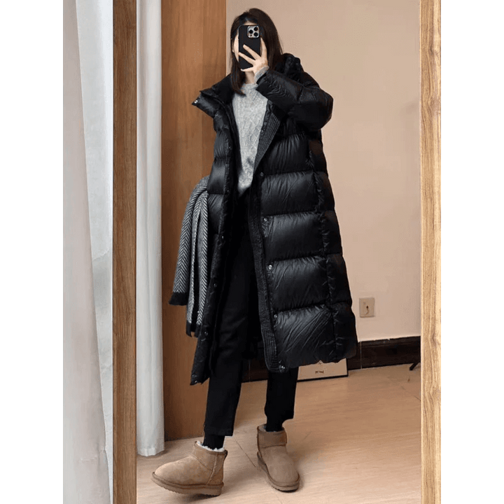 Warm & stylish women's long padded jacket. Essential winter coat and fashionable cold weather outerwear.