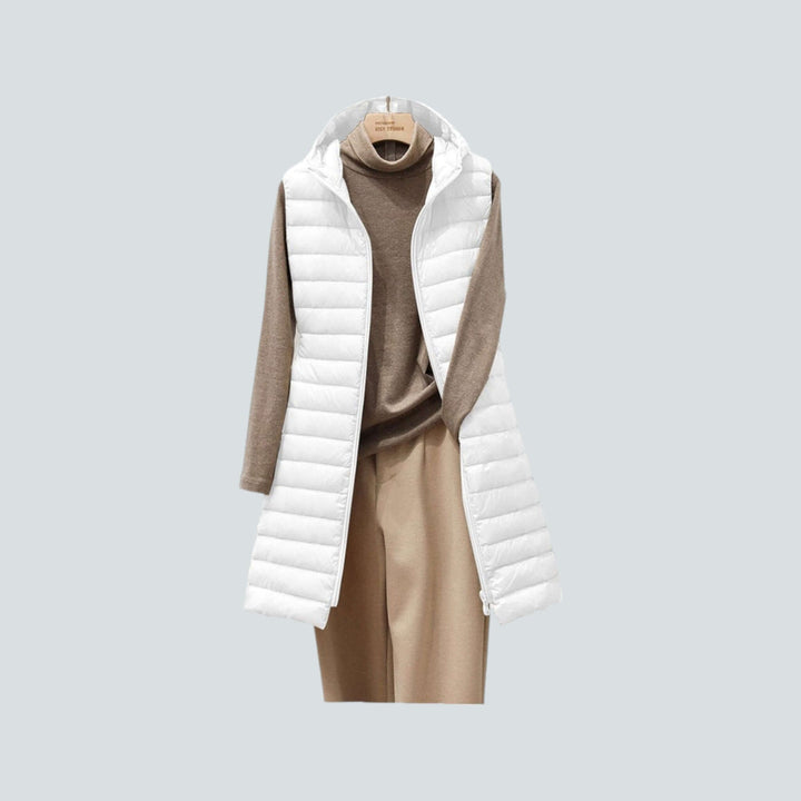 Cozy women's long black quilted puffer vest, a warm and stylish sleeveless jacket ideal for winter.