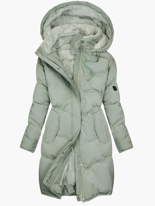 Women's long quilted winter coat with hood, perfect for ultimate warmth & cold weather. Stylish outerwear.