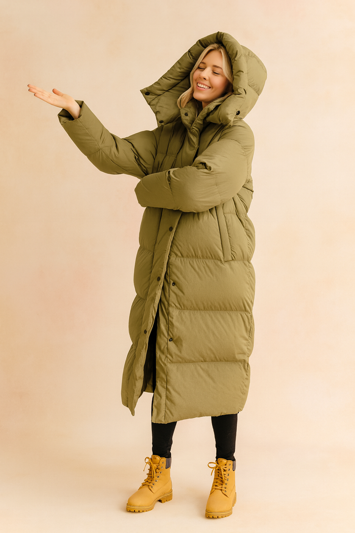 Women's long quilted winter jacket with hood. Warm, stylish puffer coat for cold weather. Cozy outerwear.