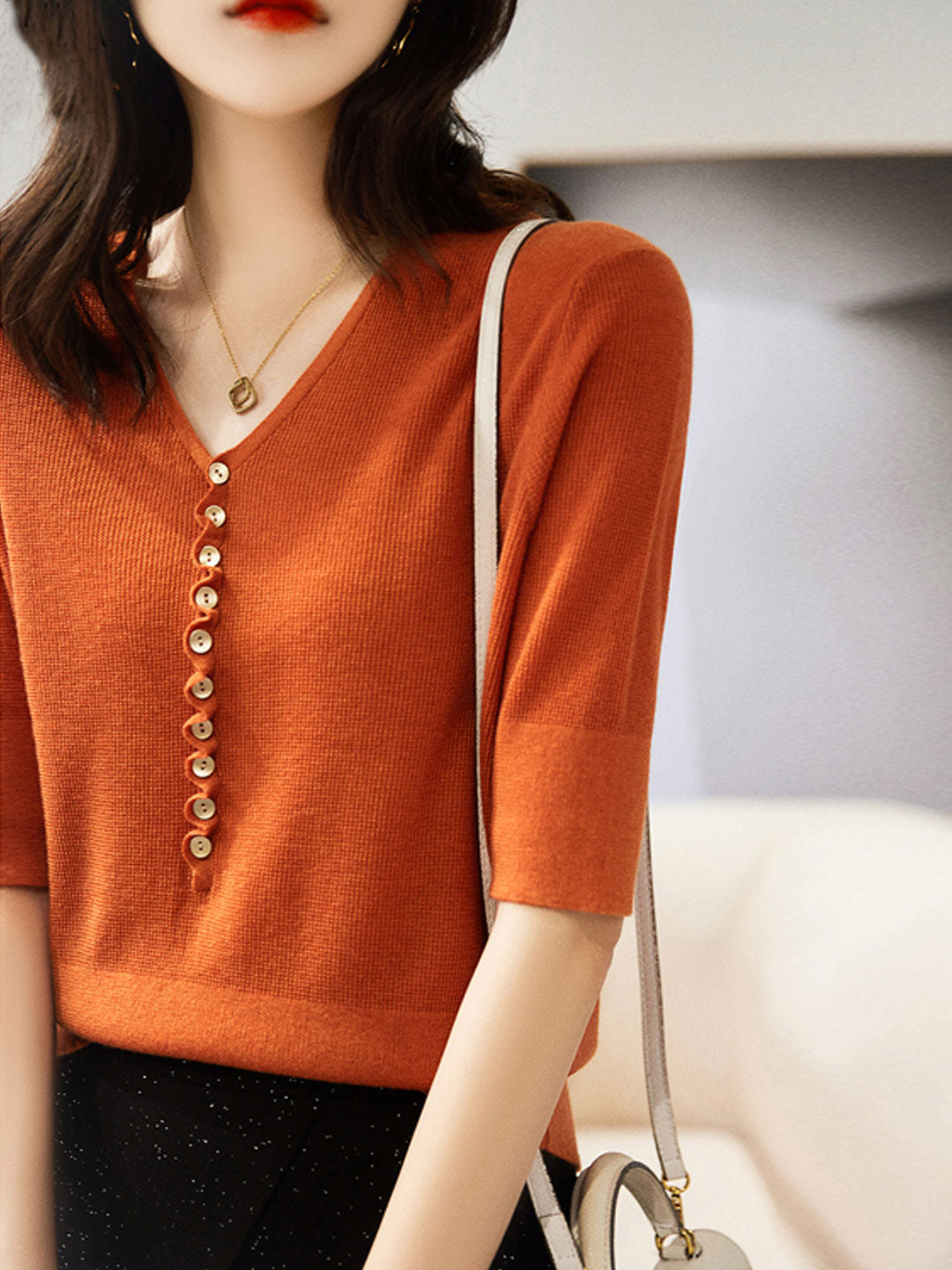 Chic women's V-neck button down knitted top, versatile for fall & winter casual outfits.