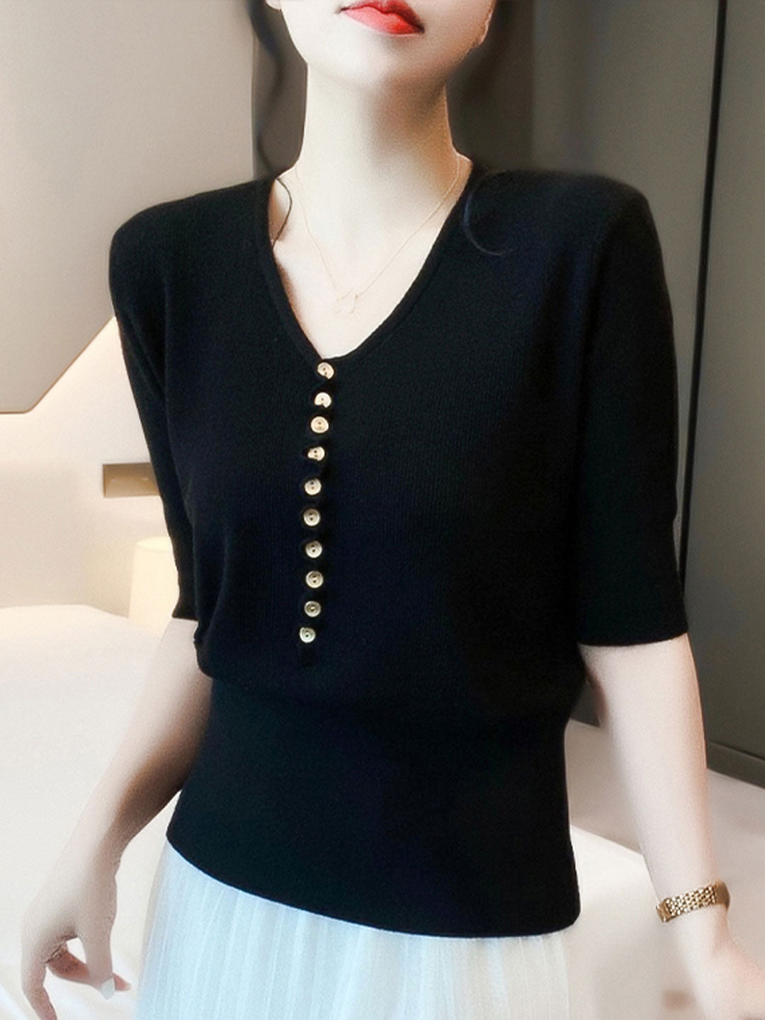 Stylish women's V-neck button knitted sweater, perfect for a relaxed yet chic winter look.