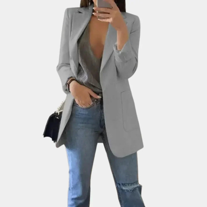 Modern women's long slim fit blazer, a chic and versatile jacket for stylish professional and casual looks.