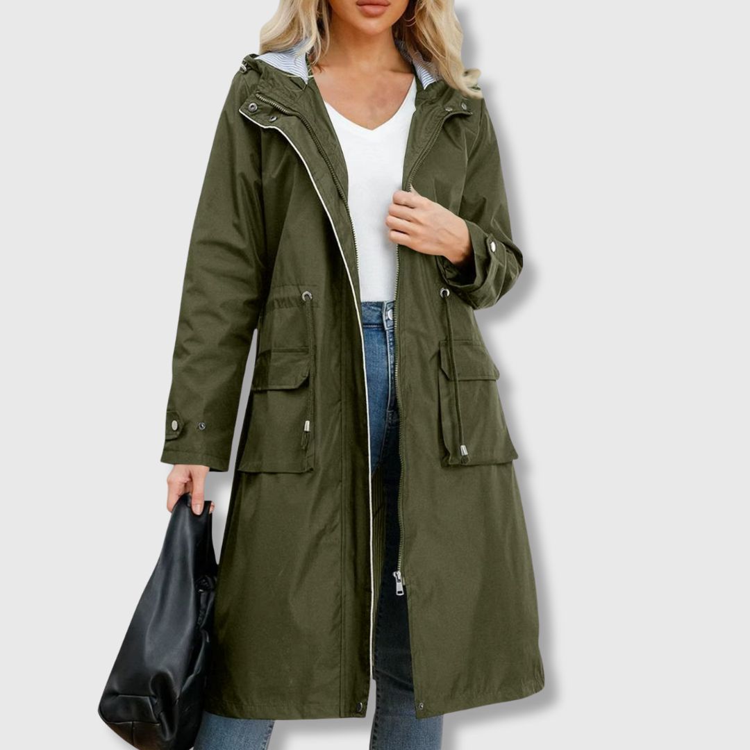 Durable women's long waterproof hooded rain jacket with drawstring waist. Perfect all-weather everyday outerwear.