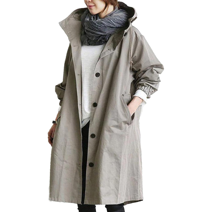 Practical women's all-weather long raincoat. Waterproof, lightweight, with adjustable hood & convenient pockets.