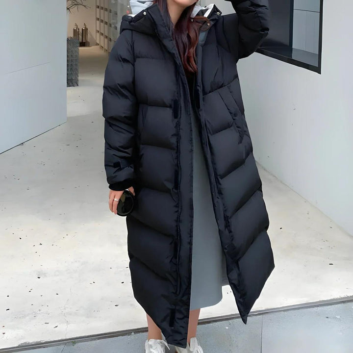 Warm women's puffer coat, long, waterproof & windproof, perfect for harsh winter essentials.