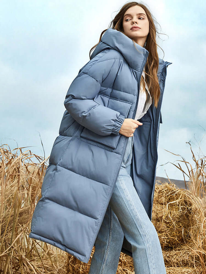 Everyday women's long winter puffer jacket with hood, designed for cold weather style and comfort.