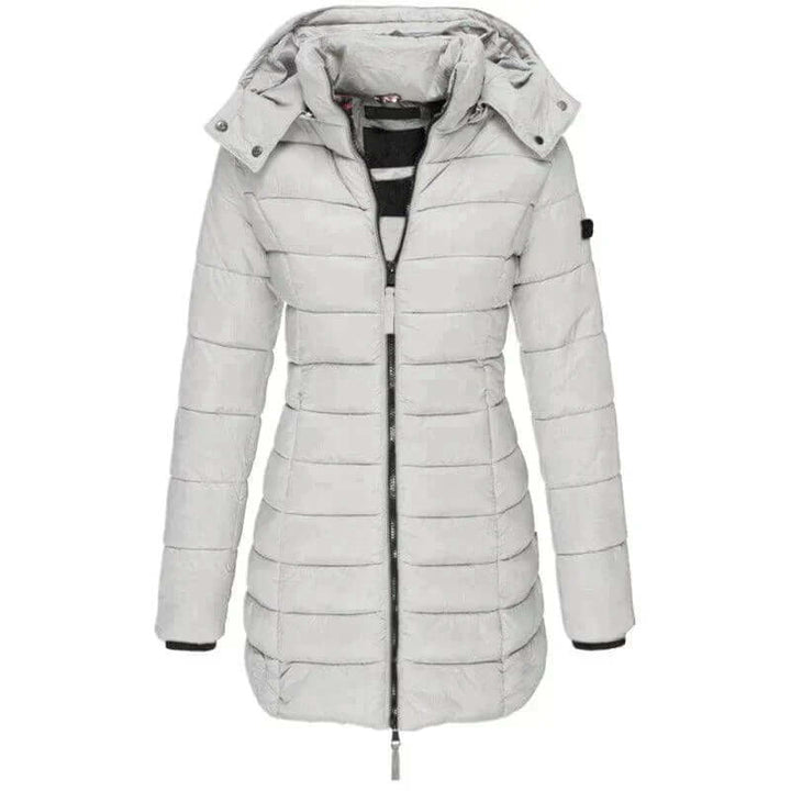 Cozy women's long puffer jacket with hood. Insulated and warm, a must-have for extreme winter cold and style.