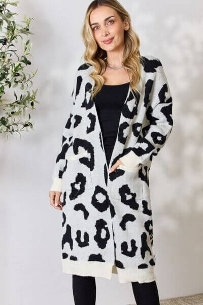 Women's longline knitted leopard print cardigan. Stylish & cozy outerwear for fashion.