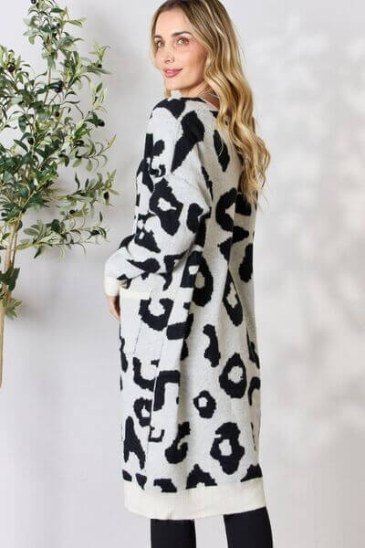 Ivory women's longline knitted cardigan with trendy leopard print. Cozy layering sweater.