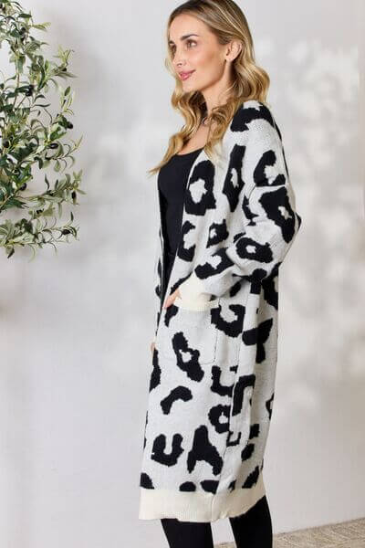 Stylish women's animal print longline cardigan. Knitted leopard sweater for cozy fashion.