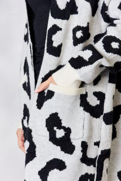 Women's knitted longline leopard print cardigan, a stylish and cozy animal print sweater.