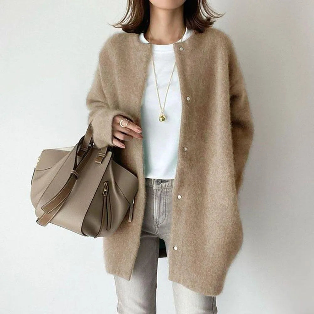 Stylish oversized women's cardigan, longline design with button-up front, perfect for layered fashion & comfort.