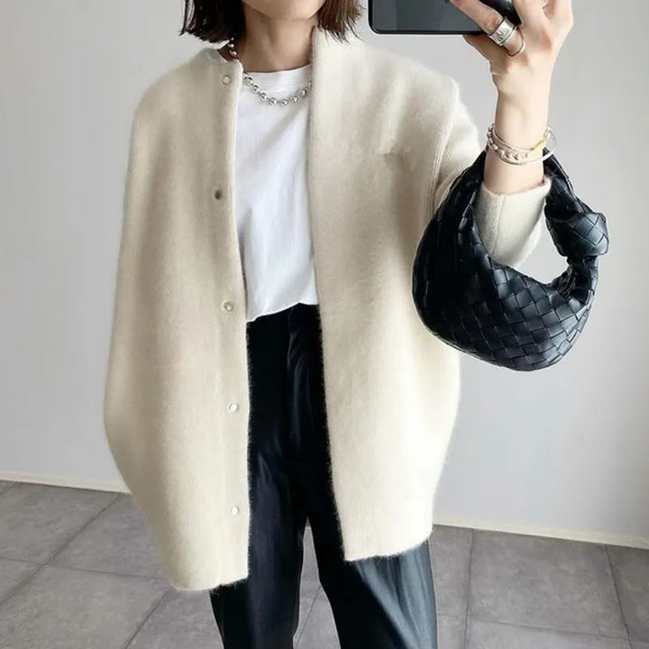 Casual women's oversized longline button-up cardigan, perfect for comfortable everyday wear and versatile layering.