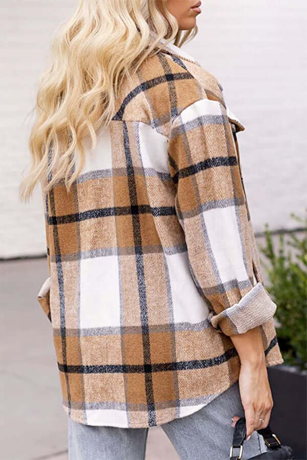 Fashionable women's checked blouse with a relaxed, loose fit. Stylish long sleeve plaid top for casual wear.