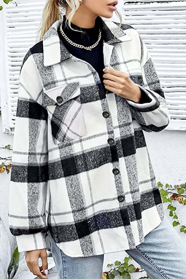 Relaxed women's checked long sleeve blouse. Loose fit plaid top offering casual comfort and modern style.