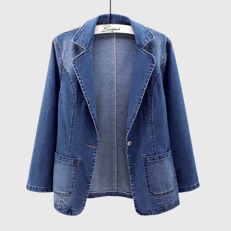 Women's loose fit collared denim jacket in classic blue. Stylish and versatile casual outerwear for everyday fashion.