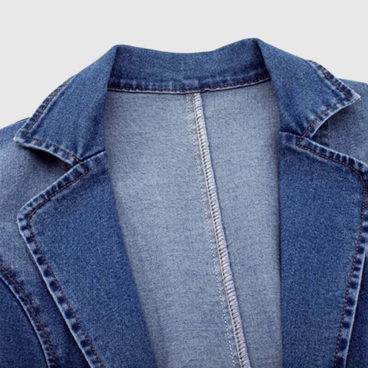Casual women's loose fit denim jacket. Features a classic collar, perfect for stylish everyday blue denim fashion.