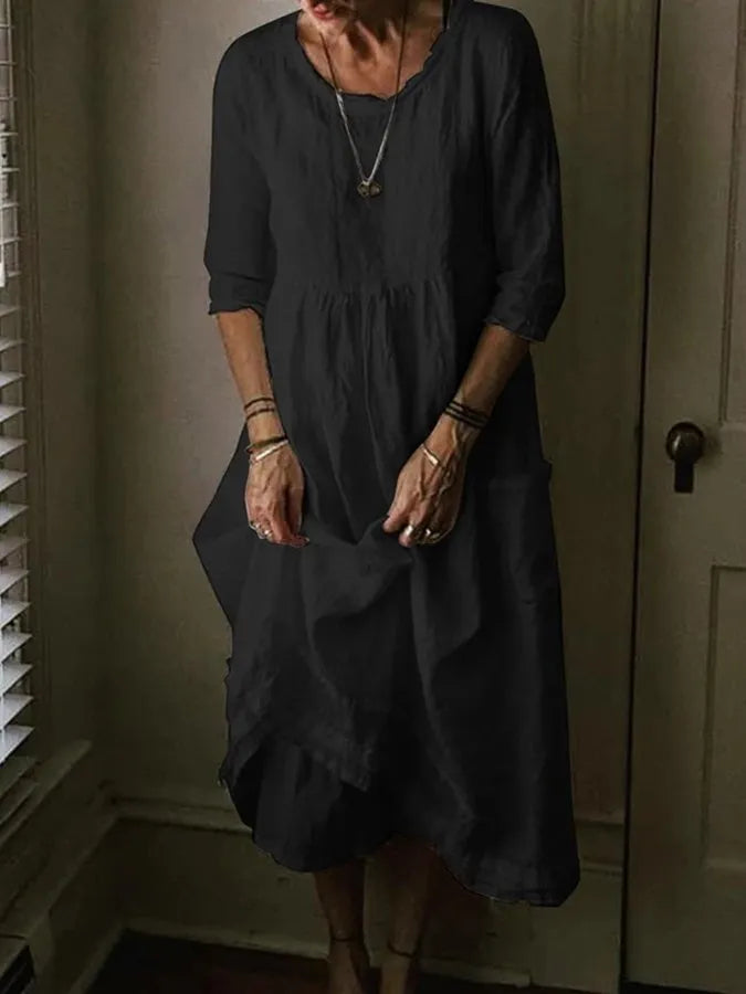 Comfortable women's cotton linen midi dress with loose fit, round neck, and practical pockets, perfect for casual spring.