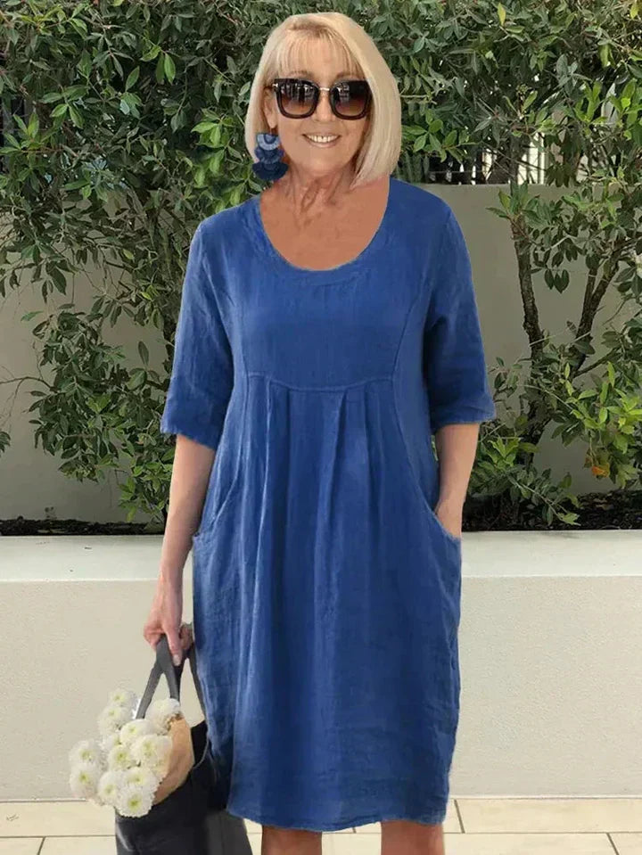 Elegant women's flowy tunic dress, comfortable for everyday wear with convenient pockets.